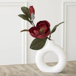 Artifical red magnolia flower with leaves