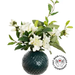 Artificial azalea flowers in a round vase
