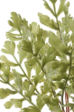 Artificial fern in dark green ceramic pot