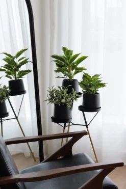 Artificial green aglaonema in a black pot