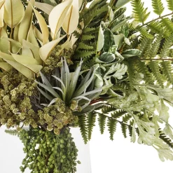 Artificial greenery and fern floral arrangement in vase