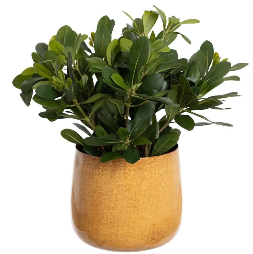 Artificial greenery in a yellow amber pot