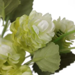 Artificial hop flowers in a glass vase