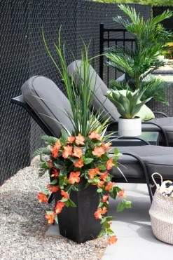 Artificial orange hibiscus flowers and grass outdoor planter, 55″