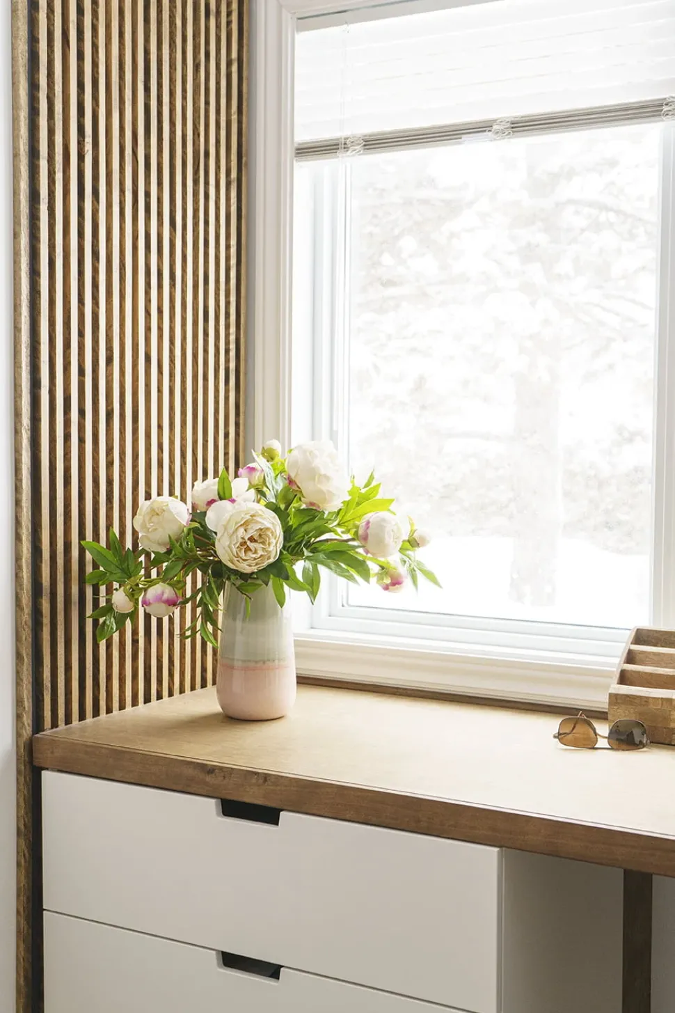 Artificial peony flower bouquet in pink vase