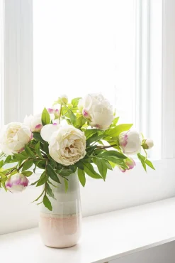 Artificial peony flower bouquet in pink vase