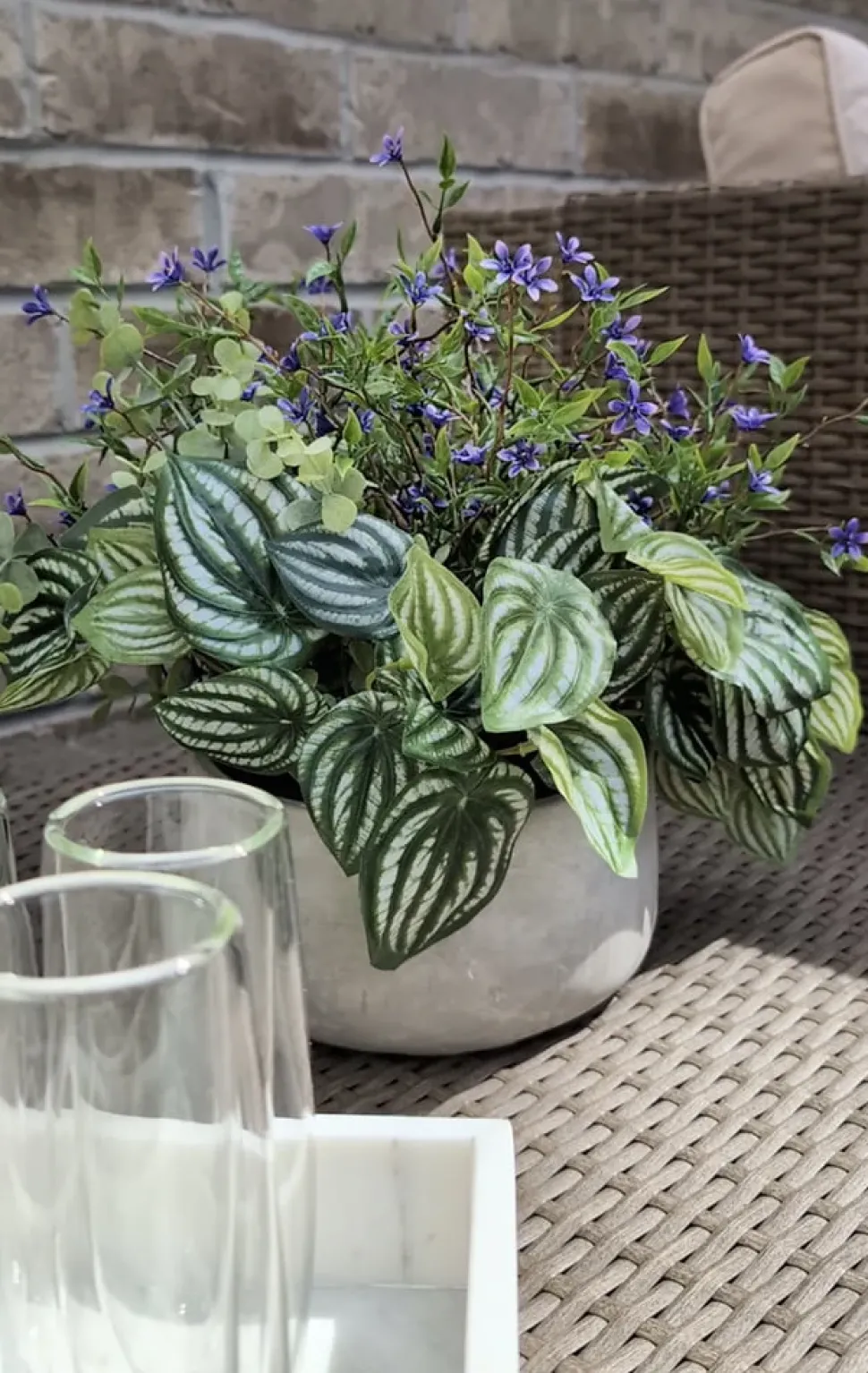 Artificial peperomia and purple outdoor flower centerpiece, 13 x 14"