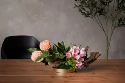 Artificial pink flower and greenery centerpiece