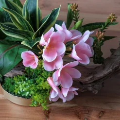 Artificial pink flower and greenery centerpiece