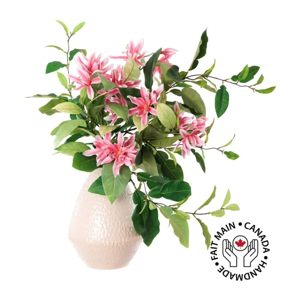 Artificial pink magnolia flower bouquet in a vase