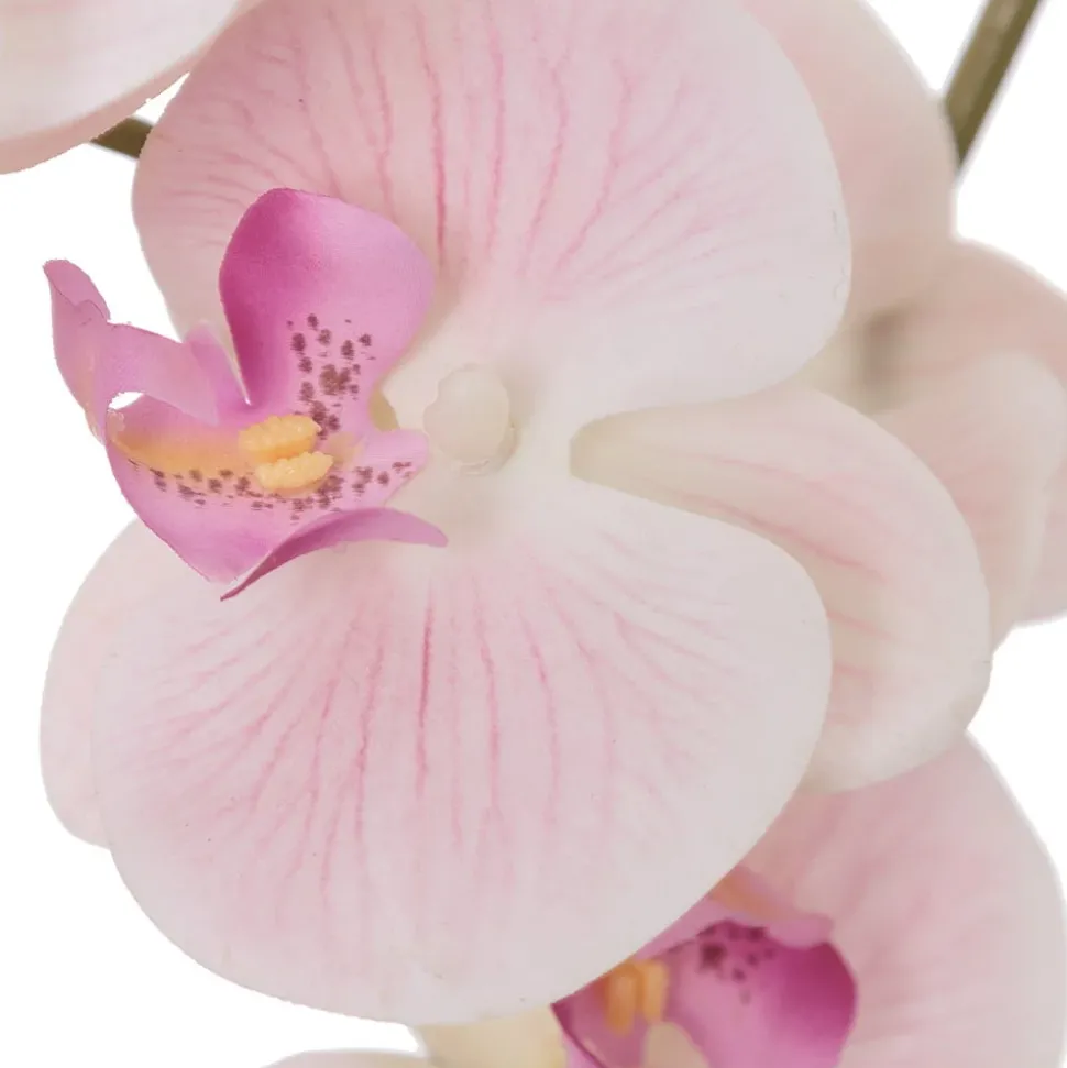 Artificial pink orchid in a white pot