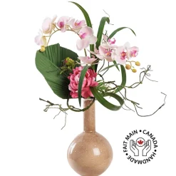 Artificial pink tropical flowers in a vase