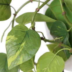 Artificial pothos in a white planter