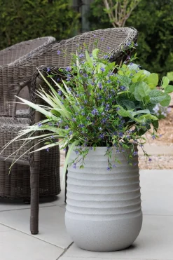 Artificial purple flower arrangement in a grey terrazzo beige pot, 26 x 12"