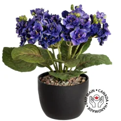 Artificial purple spring flower bouquet in a black pot