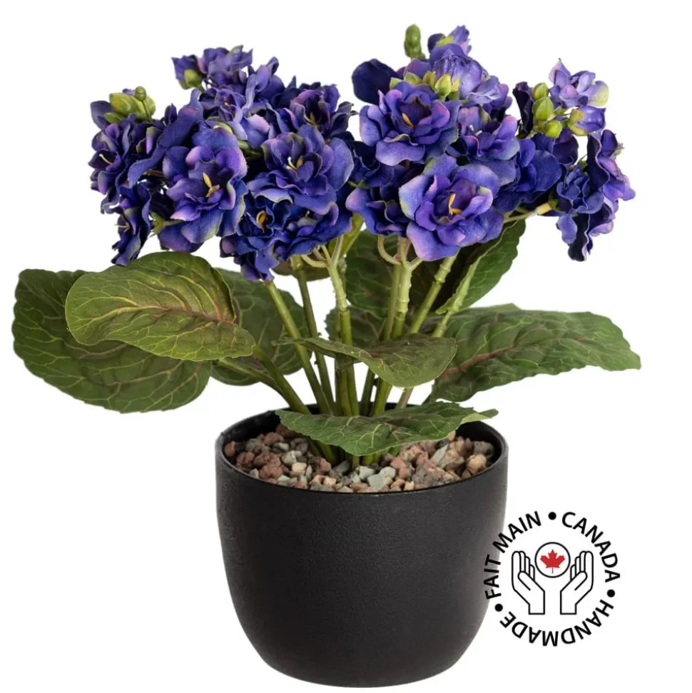 Artificial purple spring flower bouquet in a black pot