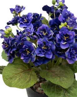 Artificial purple spring flower bouquet in a black pot