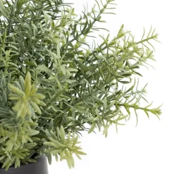 Artificial verdigris grasses in a black pot