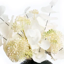 Artificial white eucalyptus in a round vase