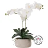 Artificial white orchid in a cement pot