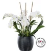 Artificial white orchid plant in a black pot