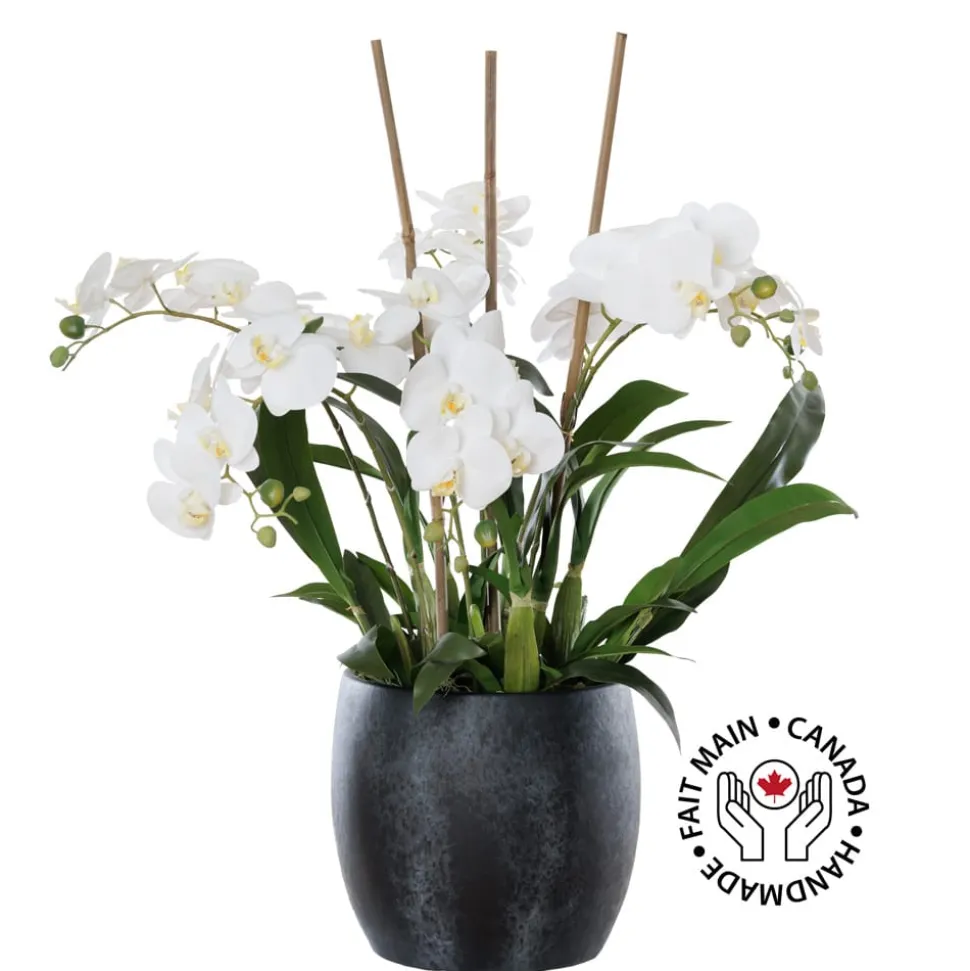 Artificial white orchid plant in a black pot
