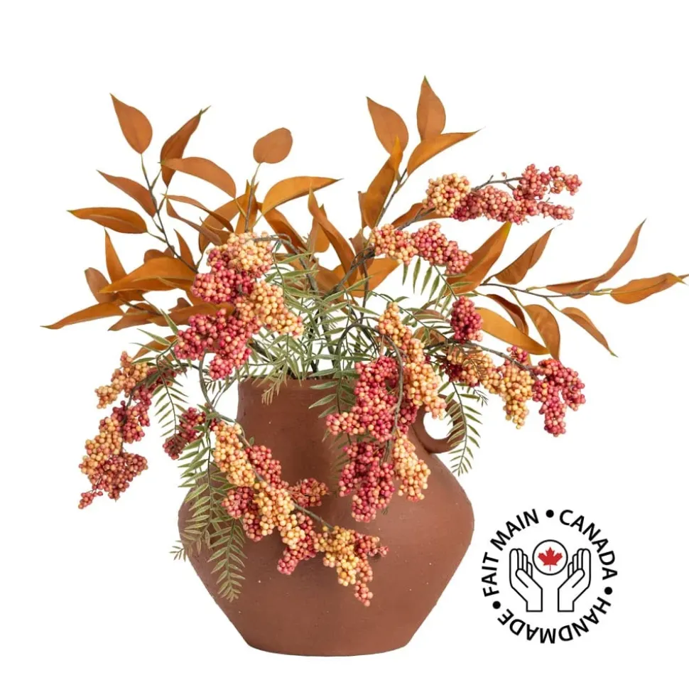 Berry and eucalyptus arrangement in a vase