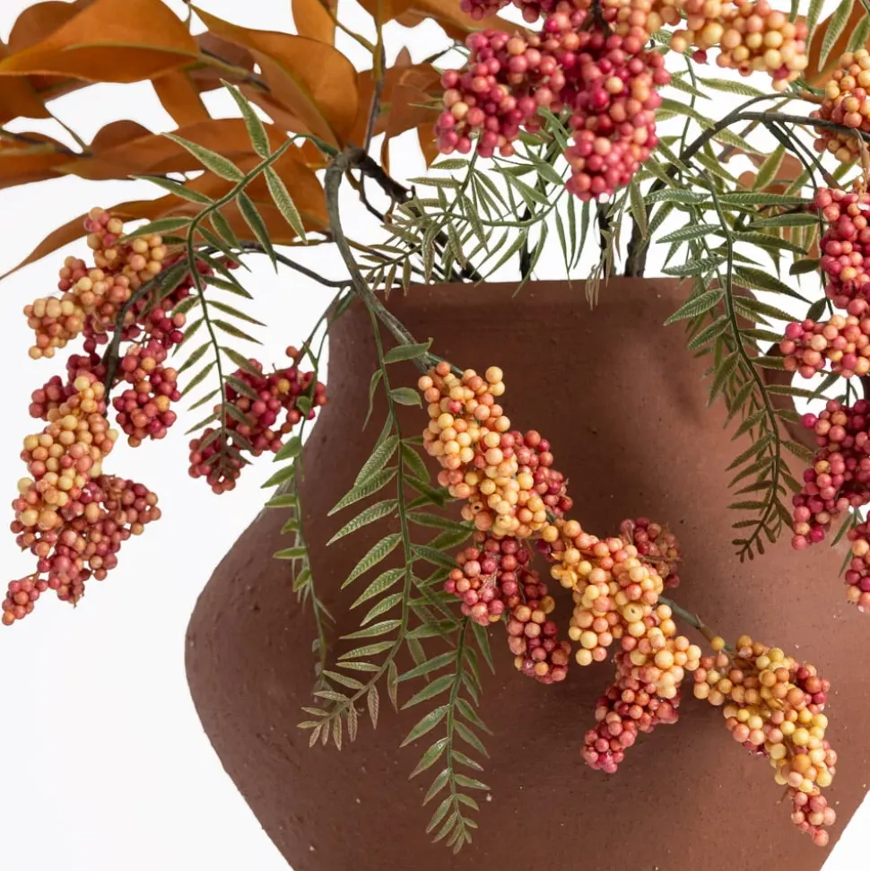 Berry and eucalyptus arrangement in a vase