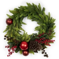 Berry and red ornament decorated Christmas wreath