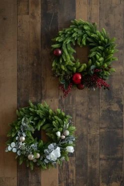 Berry and red ornament decorated Christmas wreath