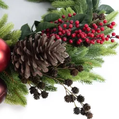 Berry and red ornament decorated Christmas wreath