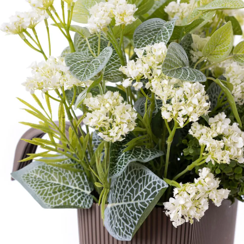 Brown balcony planter of artificial plants and white flowers
