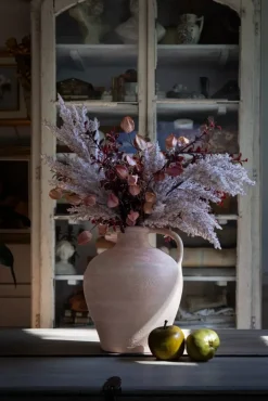 Burgundy and cream flower arrangement