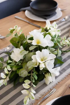 Greenery and white flower centerpiece, 6 x 21″
