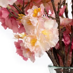 Pink cherry blossom bouquet in a vase