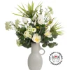 Renonculus and white flower bouquet in a vase