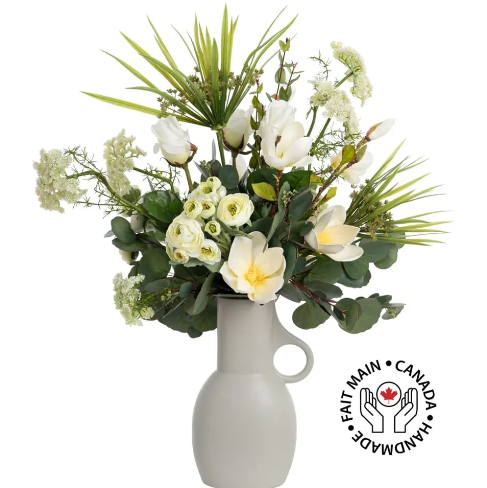 Renonculus and white flower bouquet in a vase
