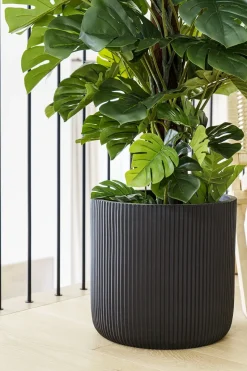 Rounded ribbed black fiber cement pot