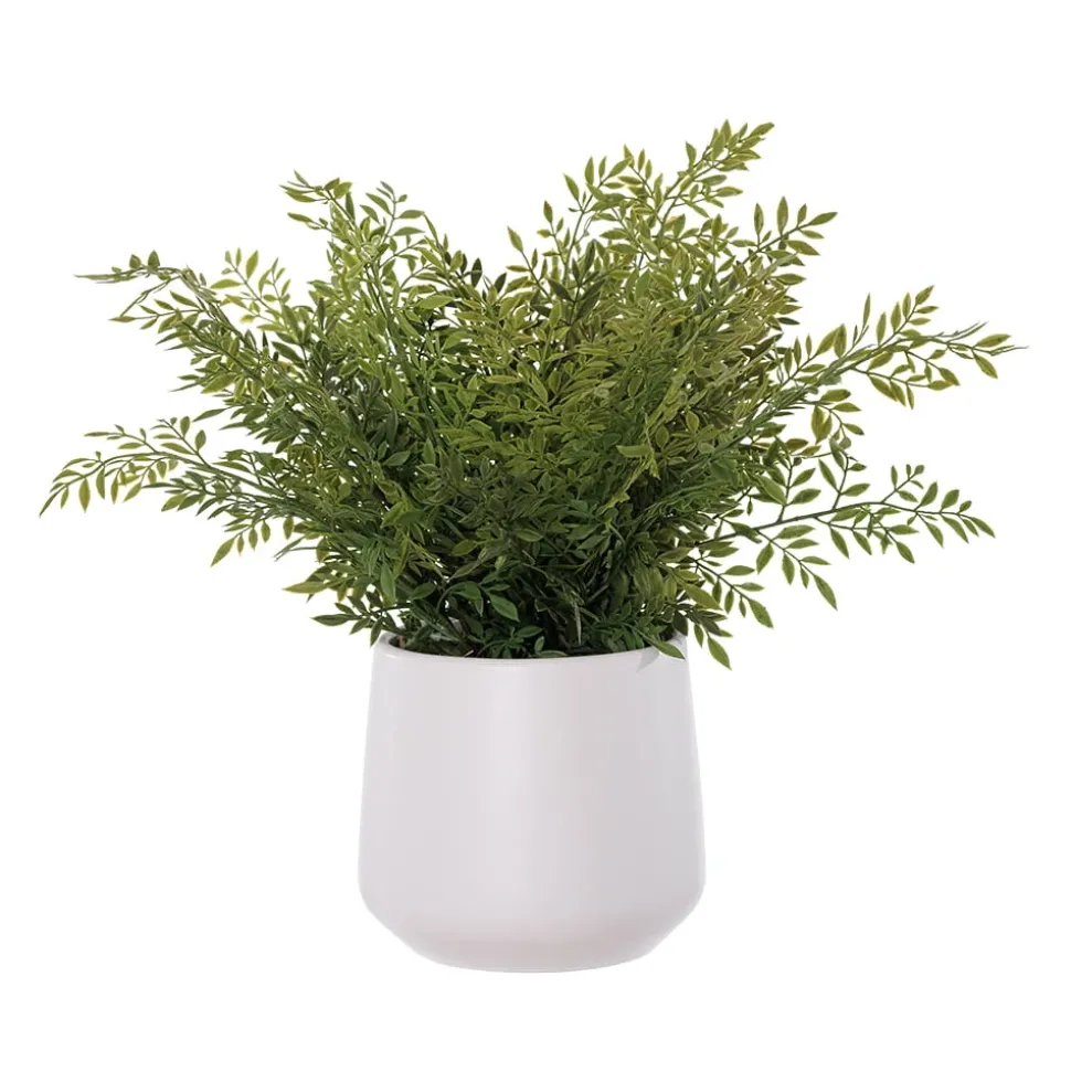 Small green fern artificial plant in a white pot