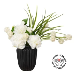 Small white flower bouquet in a black vase